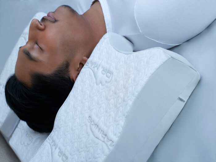 woman comfortably sleeping on a white pillow