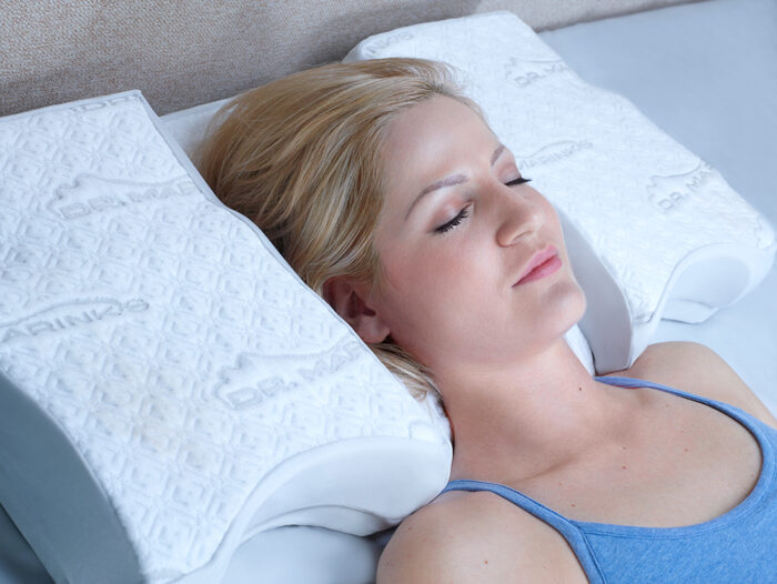 woman dozed off on a white pillow