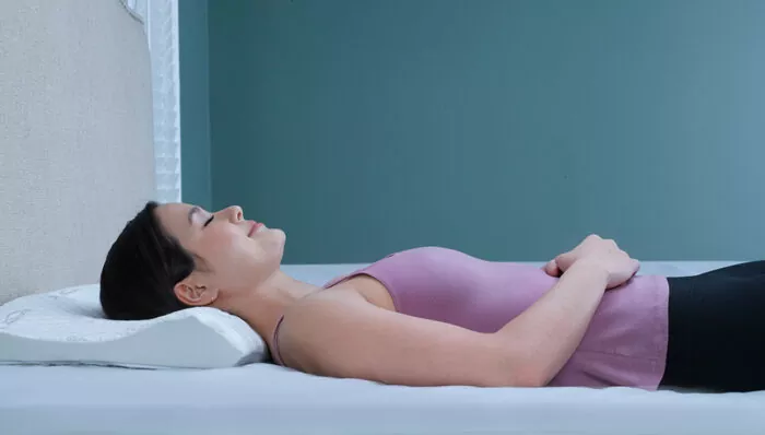 woman fast asleep on a back sleeper pillow