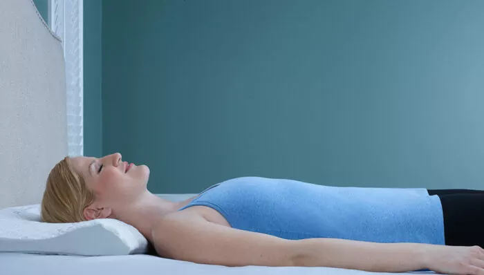 woman sleeping on a back sleeper pillow