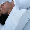 woman comfortably sleeping on a white pillow